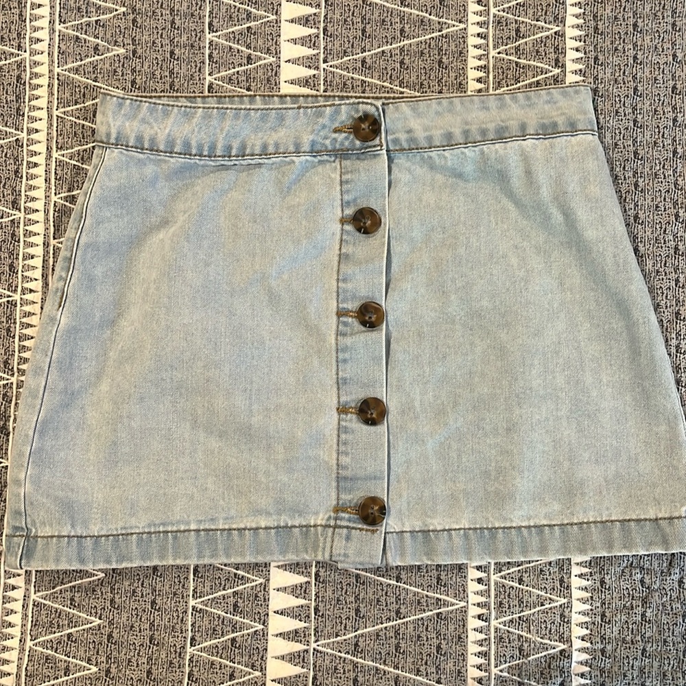 Jean skirt, distressed, button down. Size large, but fits more like a medium.